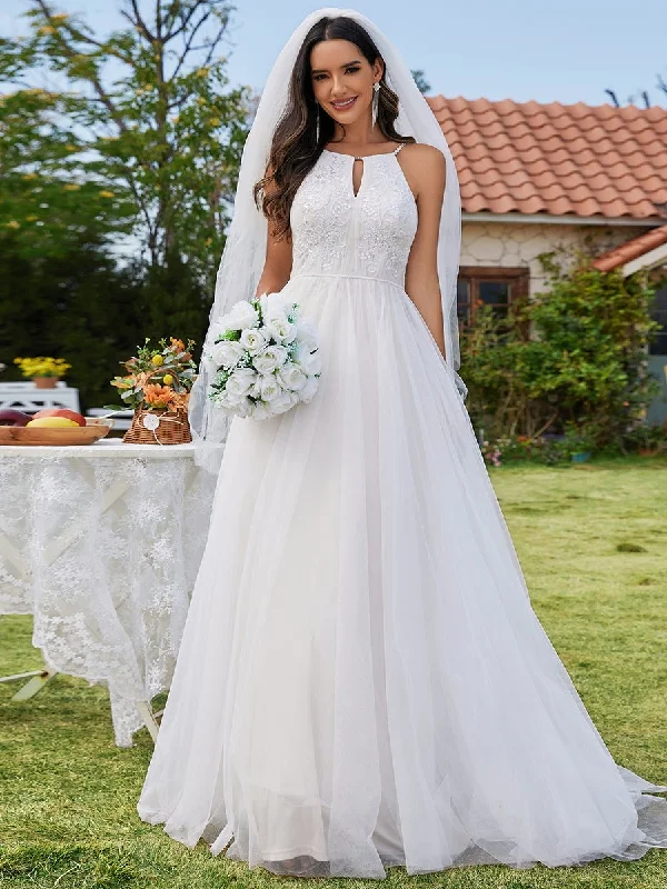 Jayden halter-neck sand/ivory wedding dress